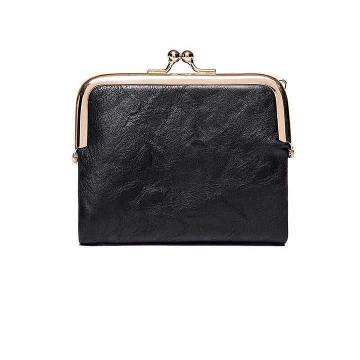 Schwarze Leder-Geldbörse mit Metallverschluss, elegantes Design, Damen-Accessoire.