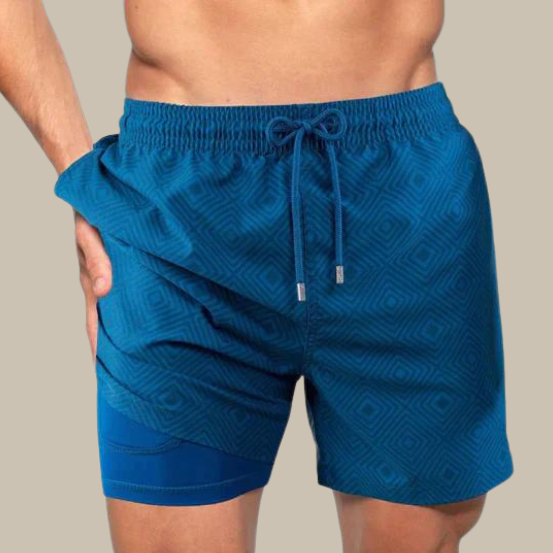 Blaues Herren-Badeshorts mit geometrischem Muster, Kordelzug und elastischem Bund.