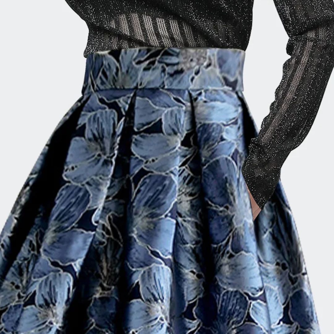 Damenrock blau geblümt, hoher Bund, elegantes Design, ideal für festliche Anlässe.