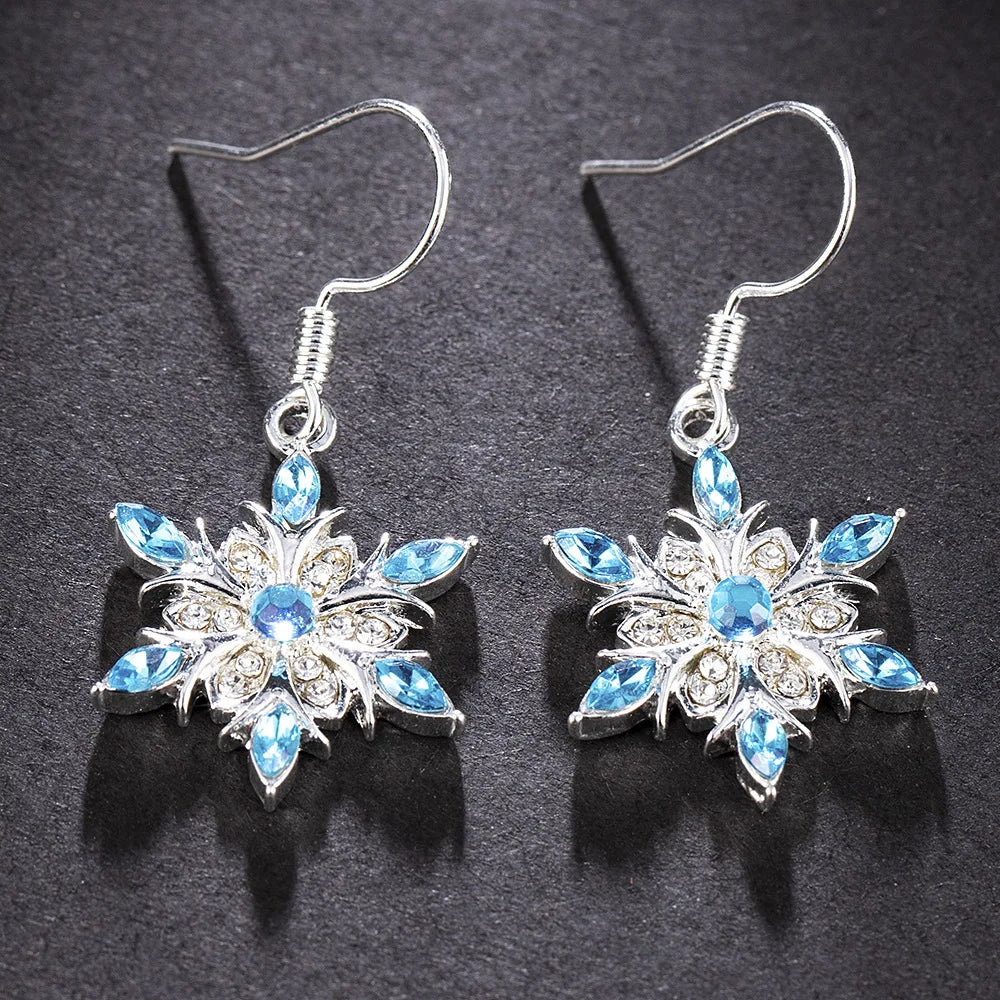 Silberne Ohrringe mit blauen Kristallen, Blumenform, eleganter Schmuck, Damenaccessoire.