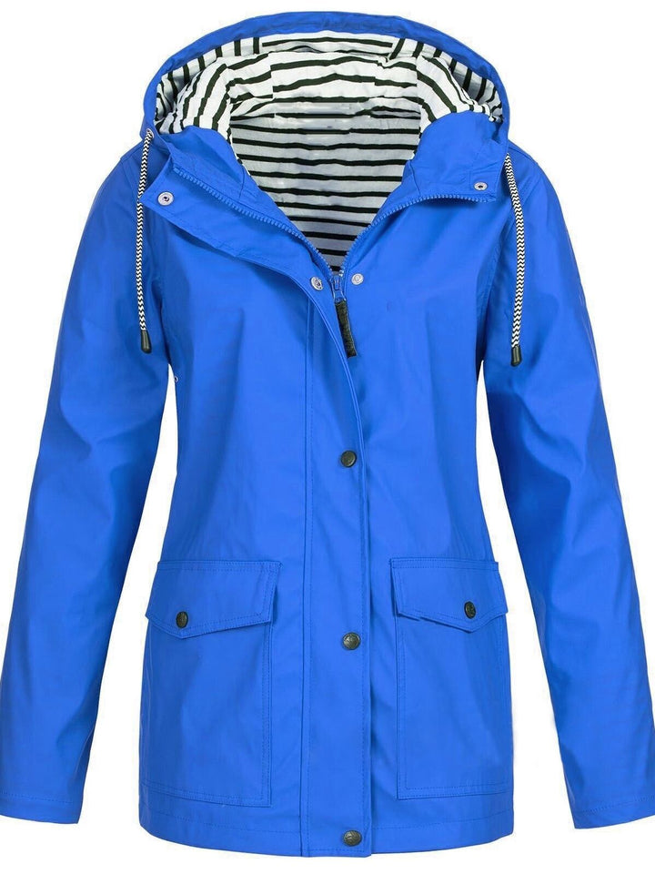 Blaue Damen-Trenchcoat mit Kapuze, lange Ärmel, gestreiftes Innenfutter, Herbstmode 2023.