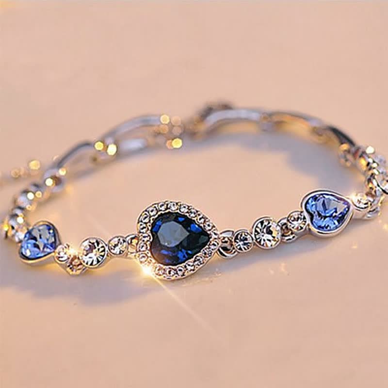 Herzförmiges Armband mit blauen Kristallen, silberfarben, eleganter Schmuck für Damen.