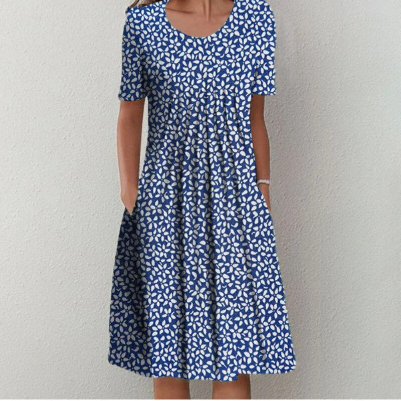Blaues Sommerkleid mit weißem Blumenmuster, knielang, kurzärmelig, lässig, Damenmode.