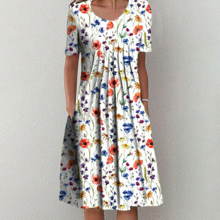 Damen Sommerkleid, weiß mit buntem Blumenmuster, kurzärmelig, knielang, lässig.