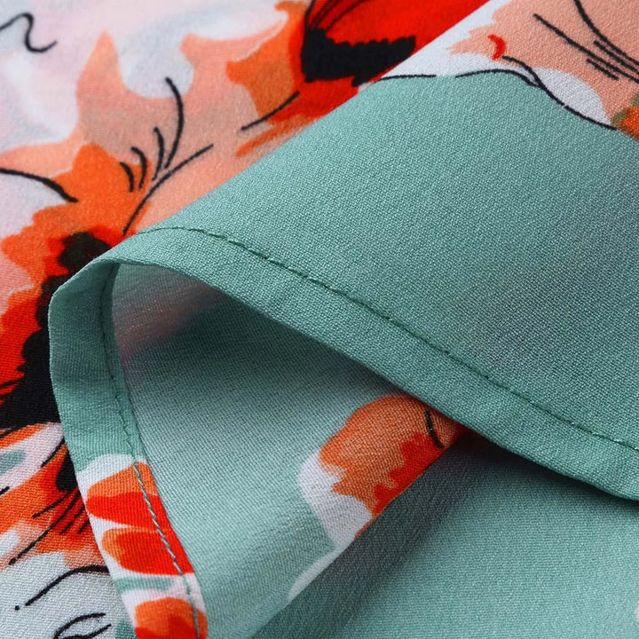 Grüner und orangefarbener Blumenstoff, Polyester, weich, für Kleidung und Dekoration.