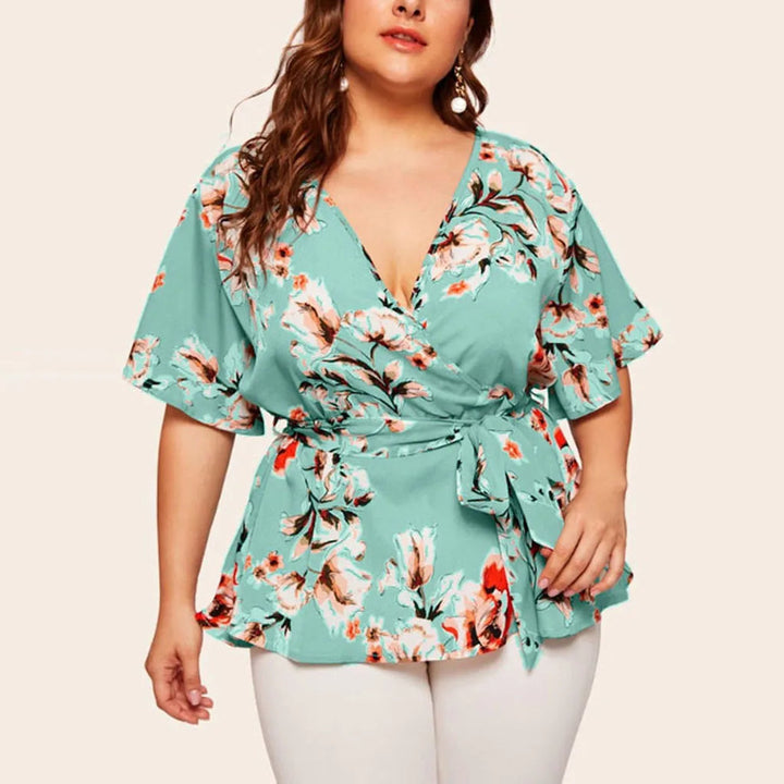 Damenbluse mit Blumenmuster, Wickeloptik, türkis, Kurzarm, Plus Size Mode.