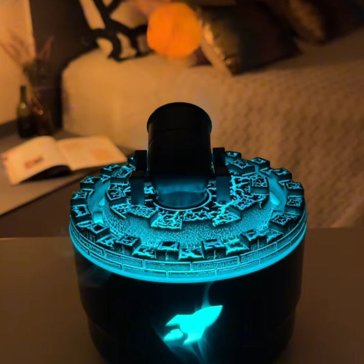 Schwarzer Kanonen-Luftbefeuchter mit blauem LED-Licht, dekorativ für Schlafzimmer.