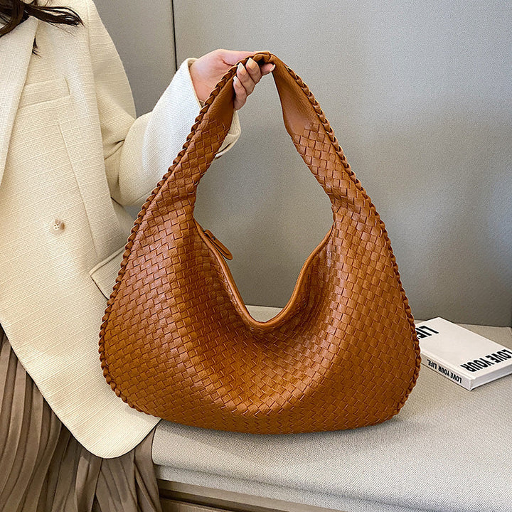 Braune geflochtene Lederhandtasche, modisch, Damenaccessoire, elegantes Design.