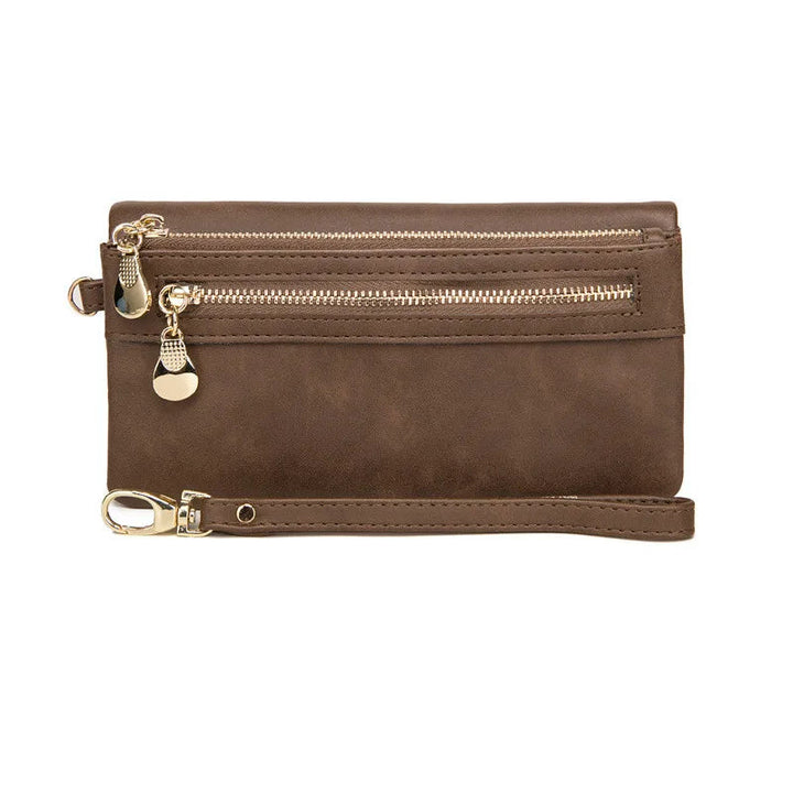Braune Lederhandtasche mit Reißverschlüssen, goldene Details, Damenmode Accessoire.