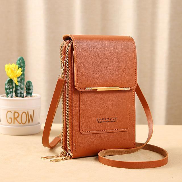 Braune Leder-Handytasche mit Schulterriemen, goldenen Reißverschlüssen, stilvoll und praktisch.