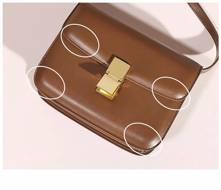 Braune Ledertasche mit goldener Schnalle, elegante Damenhandtasche, modisches Accessoire.