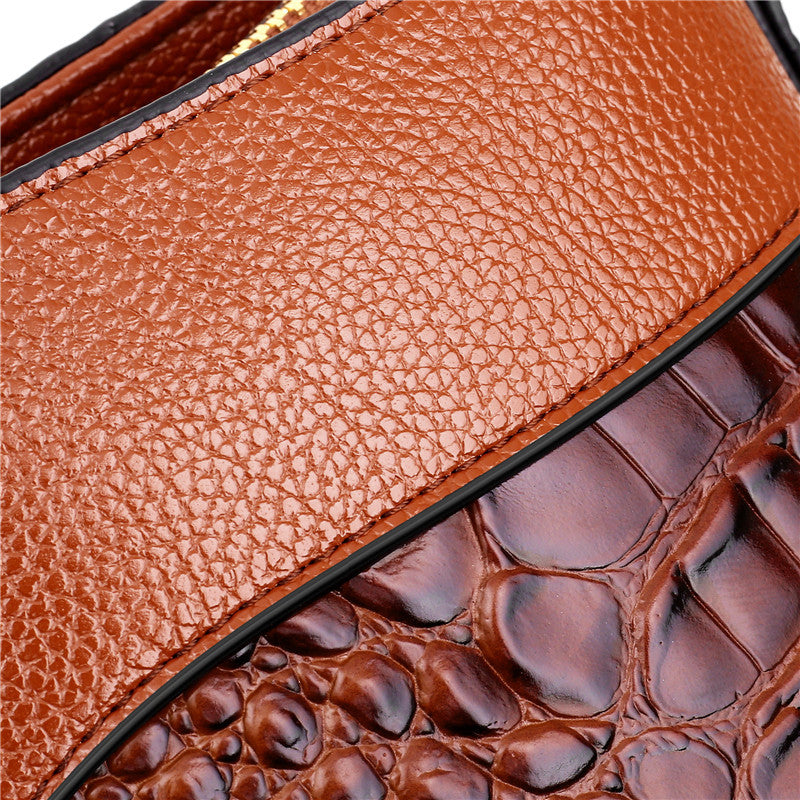 Braune Ledertasche mit Krokodilprägung, luxuriöses Design, hochwertige Handtasche.