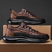 Braune Air-Cushion-Sneaker, Lederoptik, schwarze Sohle, modische Herrenschuhe.