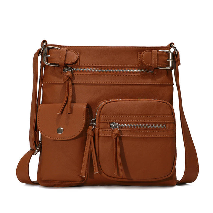Braune, multifunktionale Anti-Diebstahl-Tasche aus Leder mit mehreren Reißverschlusstaschen.