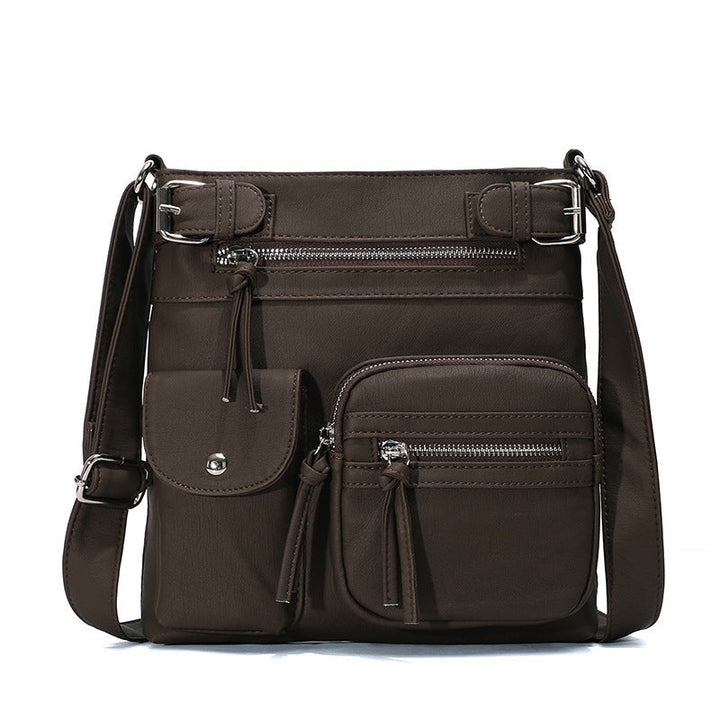 Braune, multifunktionale Anti-Diebstahl-Tasche aus Leder mit mehreren Reißverschlusstaschen.