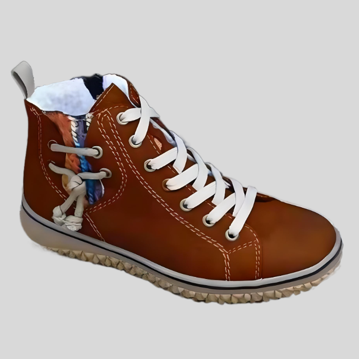 Brauner Damen-Sneaker aus Leder mit weißen Schnürsenkeln und seitlichem Zierknoten.