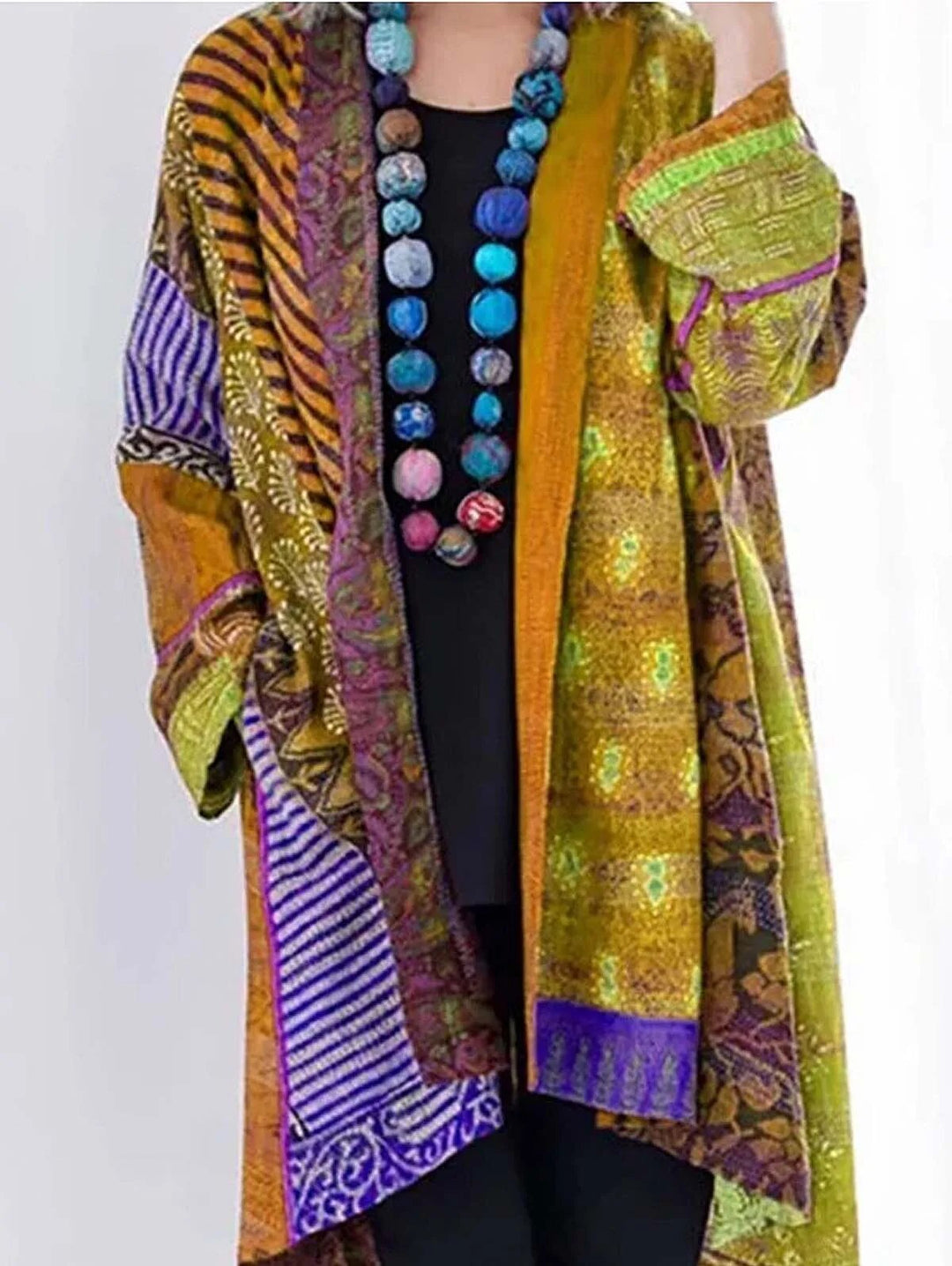 Bunte Damenjacke mit ethnischem Muster, gelb und lila, aus Baumwolle, modisch und farbenfroh.