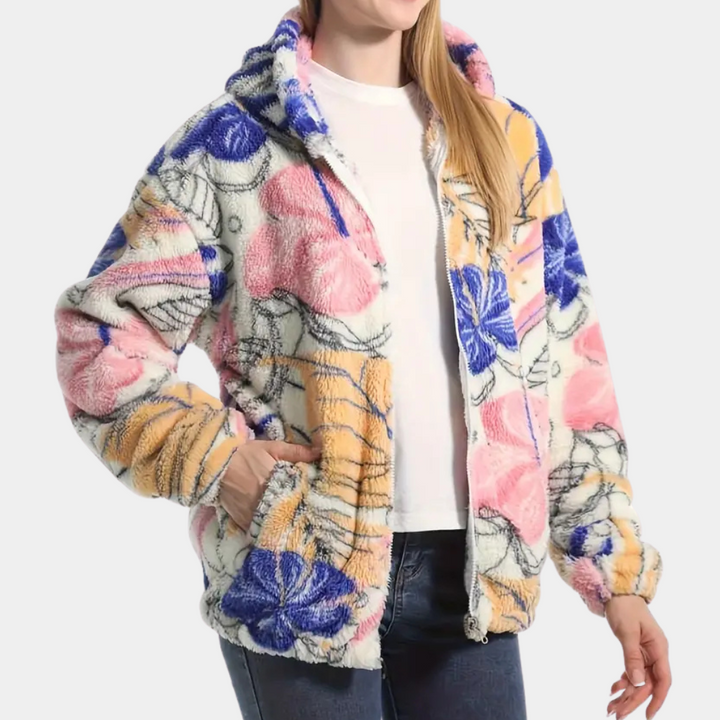 Flauschige Damenjacke mit Blumenmuster, Kapuze, Reißverschluss, rosa-blau-gelb, Freizeitmode.