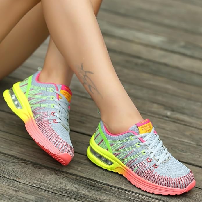 Graue Damen-Sneaker mit neonfarbenen Akzenten, atmungsaktiv, ideal für Sport und Freizeit.