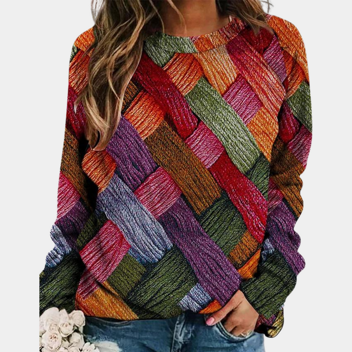 Frau in buntem Strickpullover, Zopfmuster, Herbstmode, lässig, Damenbekleidung, orange.