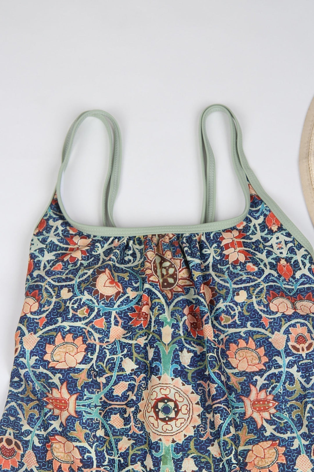 Bunter Damen-Badeanzug mit floralem Muster, Spaghettiträger, blau-orange, Sommermode.