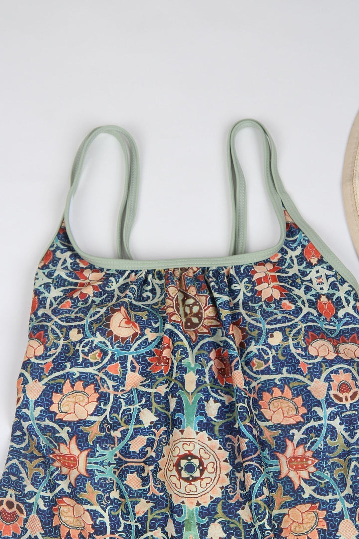 Bunter Damen-Badeanzug mit floralem Muster, Spaghettiträger, blau-orange, Sommermode.