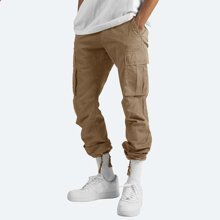 Beige Cargo-Hose für Herren, Baumwolle, mit Taschen, lässiger Stil, ideal für Freizeitkleidung.