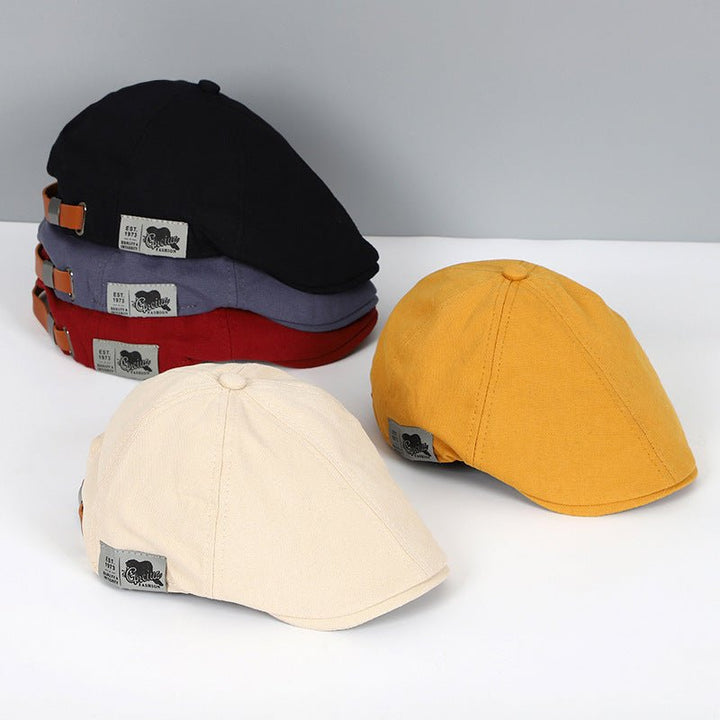 Sechs Schiebermützen in Schwarz, Rot, Grau, Gelb, Beige; Baumwolle, Unisex, modisch.