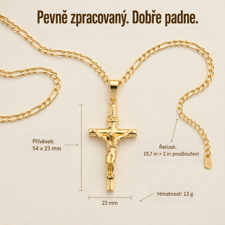Zlatý krucifix s řetízkem Figaro a prodlužovacím článkem rozložený na krémovém podkladu s vyznačenými rozměry 6