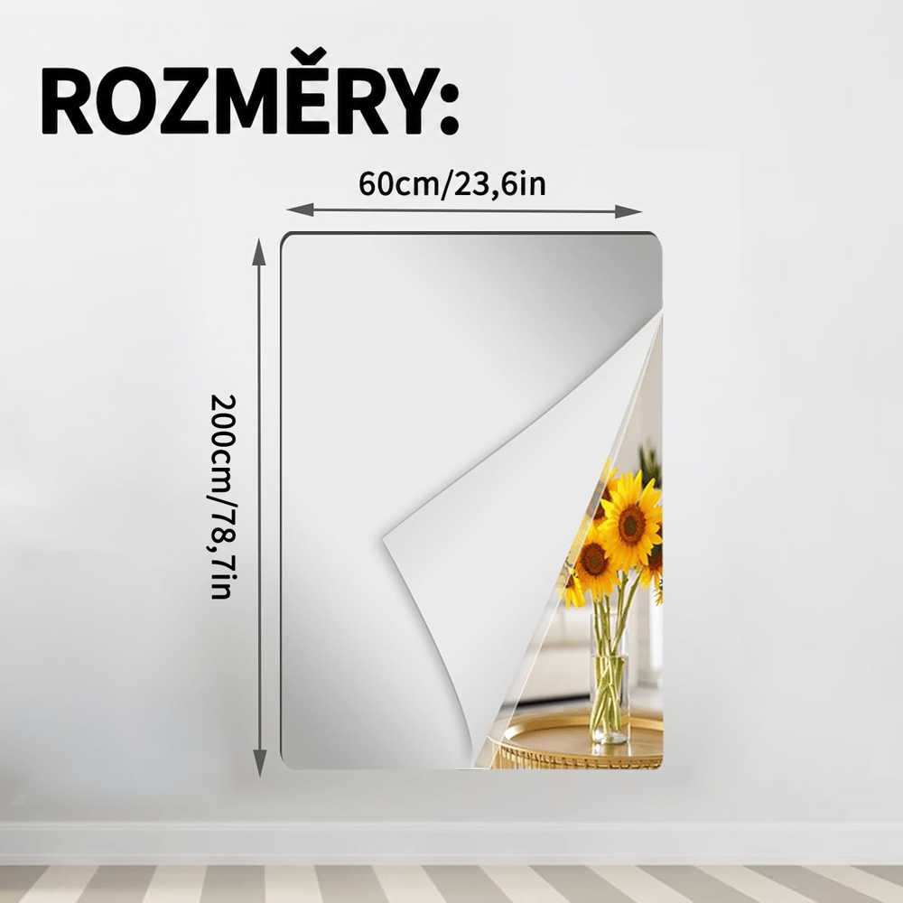 Největší zobrazená obdélníková zrcadlová fólie na stěně s odlepeným rohem a odrazem slunečnic, s vyznačenými rozměry. 15