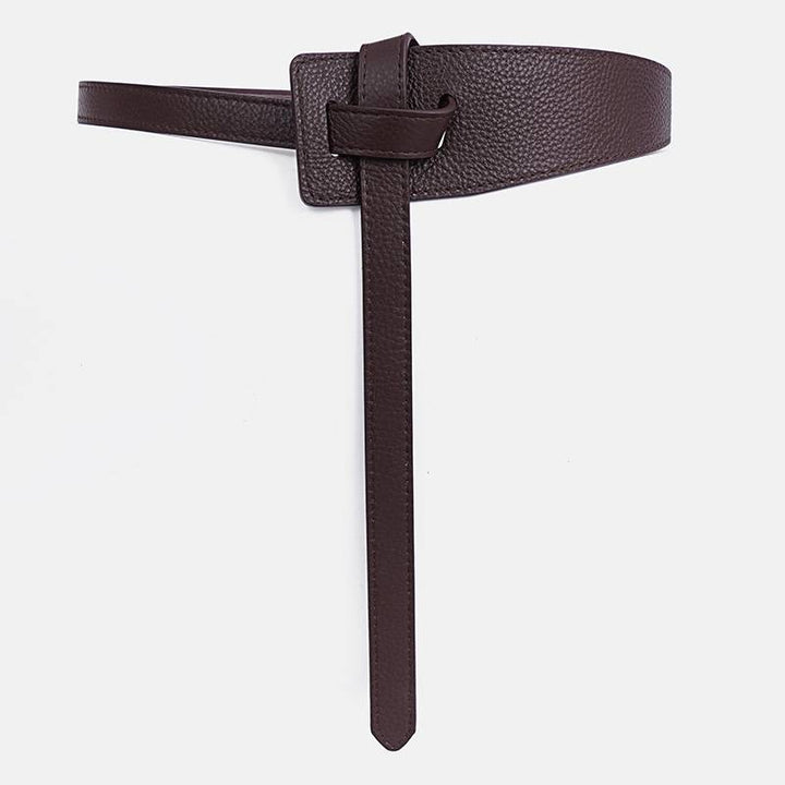 Dunkelbrauner Ledergürtel, minimalistisches Design, modisches Accessoire, Damenmode.