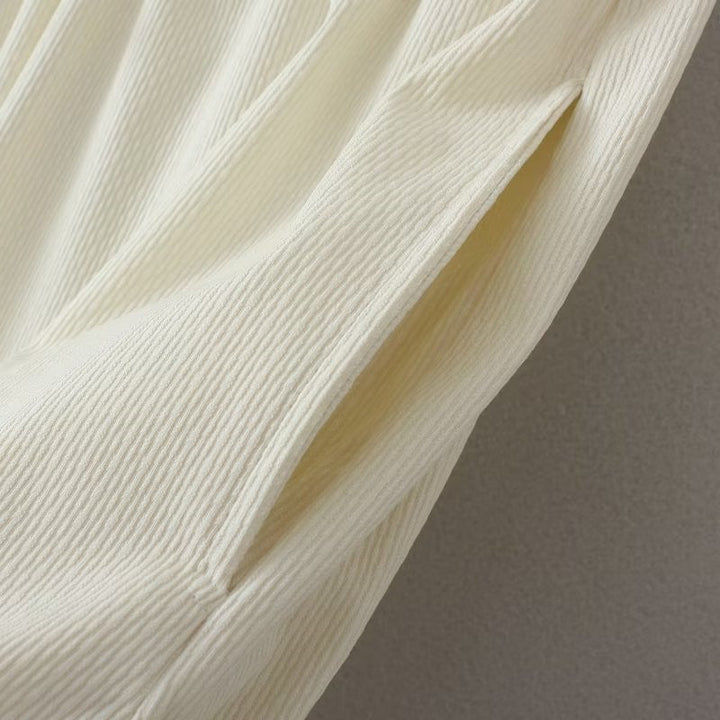 Beige gerippter Stoff, Nahaufnahme, Textur, Mode, Material, Detailansicht, Stoffdesign, Bekleidung.