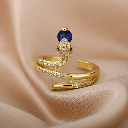 Goldener Schlangenring mit Zirkonia und blauen Steinen, Damenring, modisches Schmuckstück.