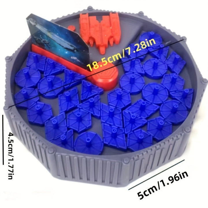 Graues rundes Spielzeug mit blauen und roten Teilen, 18,5 cm Durchmesser, 5 cm Höhe.