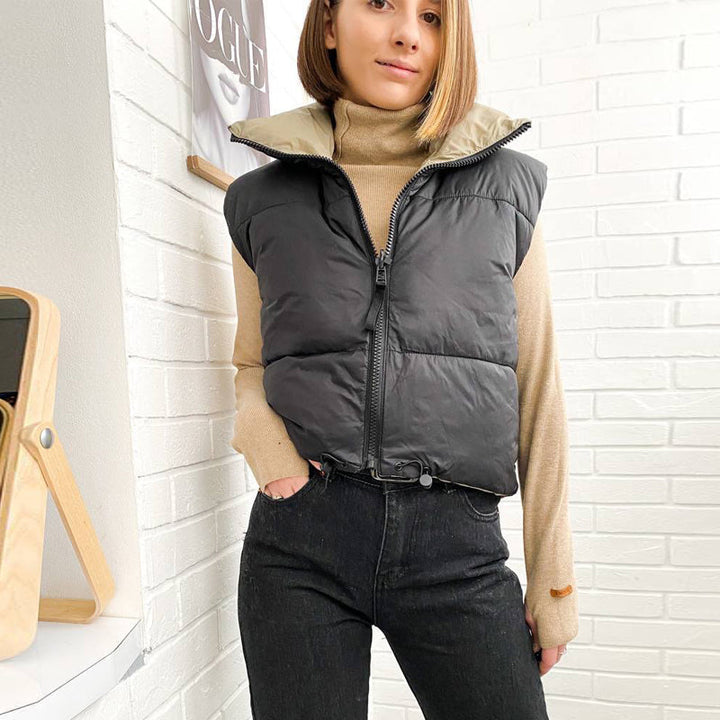 Damen Bodywarmer, schwarz-beige, gesteppt, mit Reißverschluss und Kordelzug, modisch, warm.
