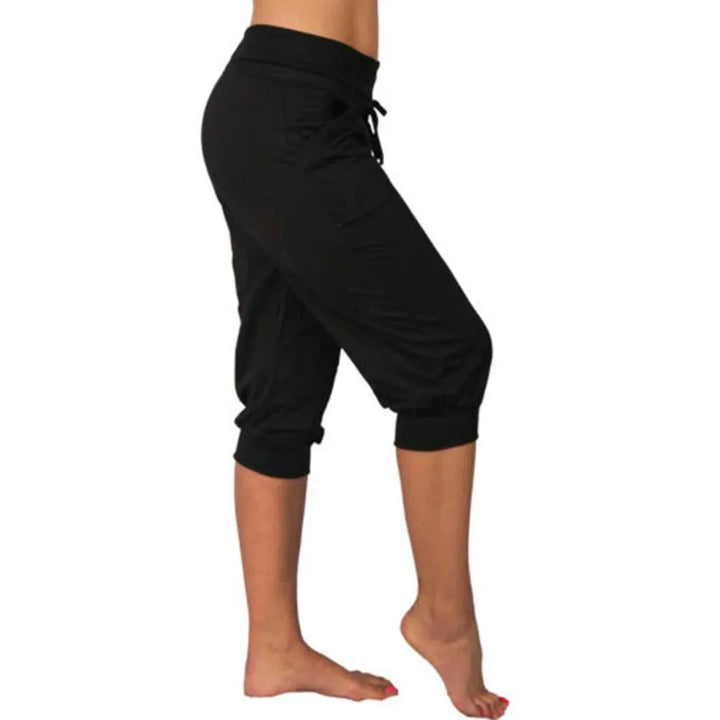 Damen Capri Yoga Hose, schwarz, locker, mit Kordelzug, Taschen, ideal für Loungewear und Sport.