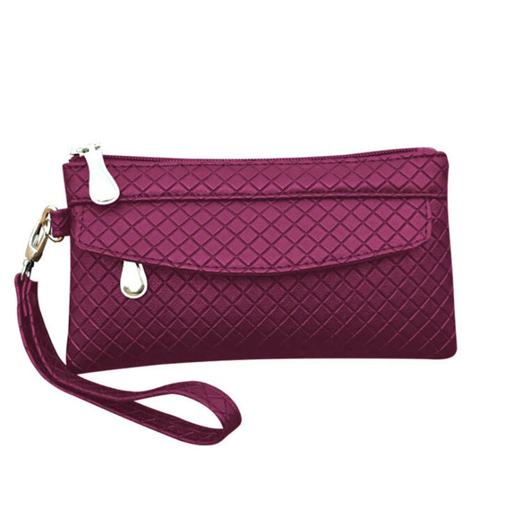 Lila Damenhandtasche mit Reißverschluss, geometrisches Muster, elegant, aus Lederimitat.