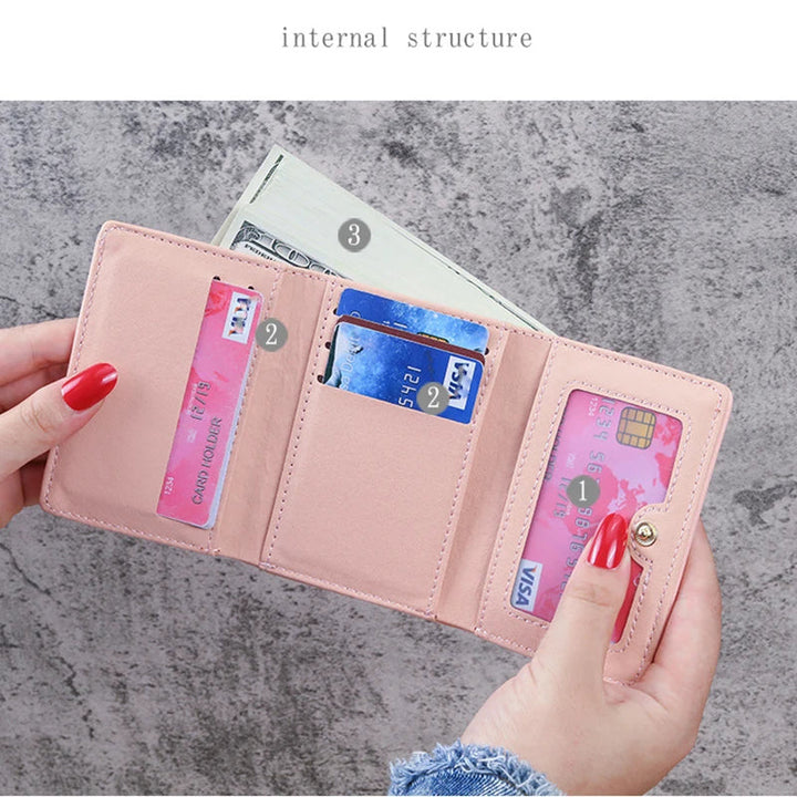 Damen-Geldbörse rosa, Leder, mit Kartenfächern und Geldscheinfach, elegant und praktisch.