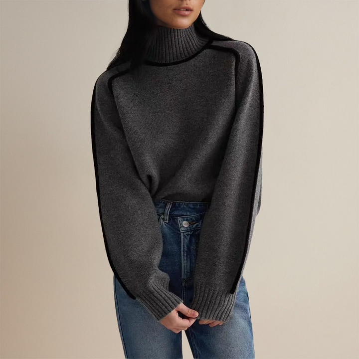 Frau in grauem Rollkragenpullover und blauer Jeans, modisch, gemütlich, Herbstmode.