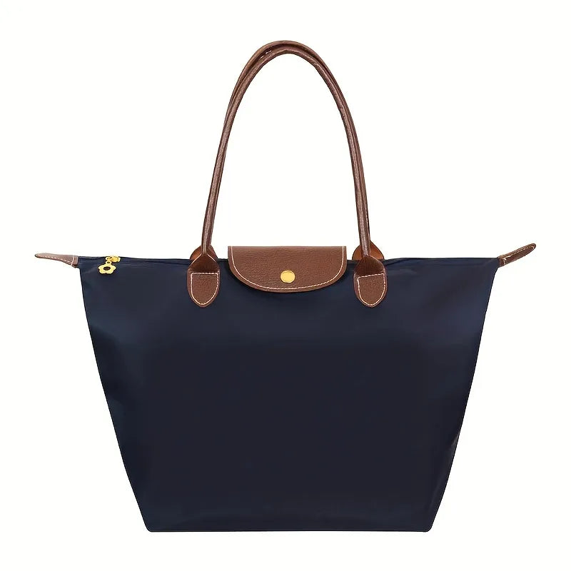 Dunkelblaue Damenhandtasche, Ledergriffe, modisch, geräumig, elegant, Alltagsgebrauch.