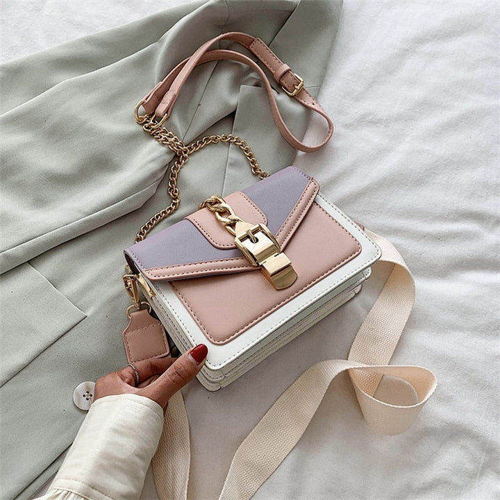 Damenhandtasche aus Leder, dreifarbig, mit Kettengurt und Schnalle, modisch und elegant.