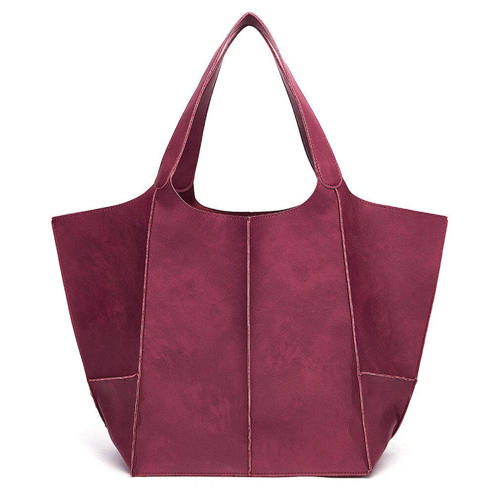 Bordeauxrote Damenhandtasche aus Leder, geräumig, modisch, ideal für Alltag und Büro.