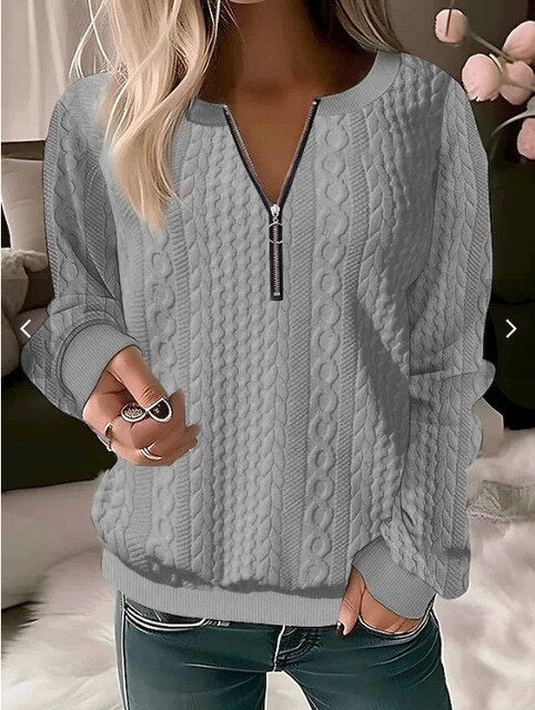 Damenpullover mit Reißverschluss, grau, Zopfmuster, langärmelig, casual, Herbstmode.