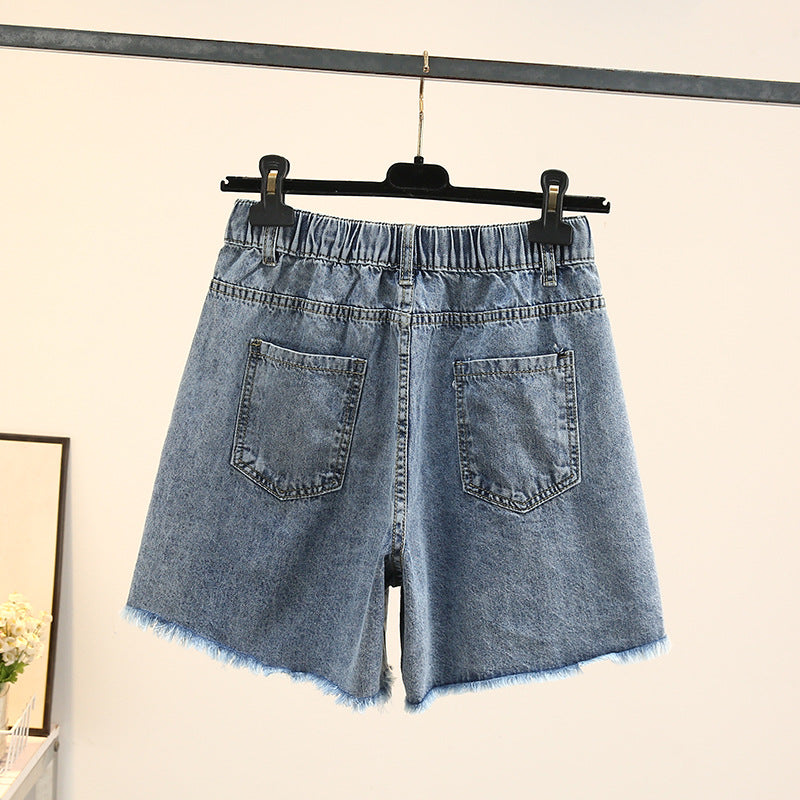 Damen Jeansshorts blau, hohe Taille, elastischer Bund, Fransen, Sommermode.