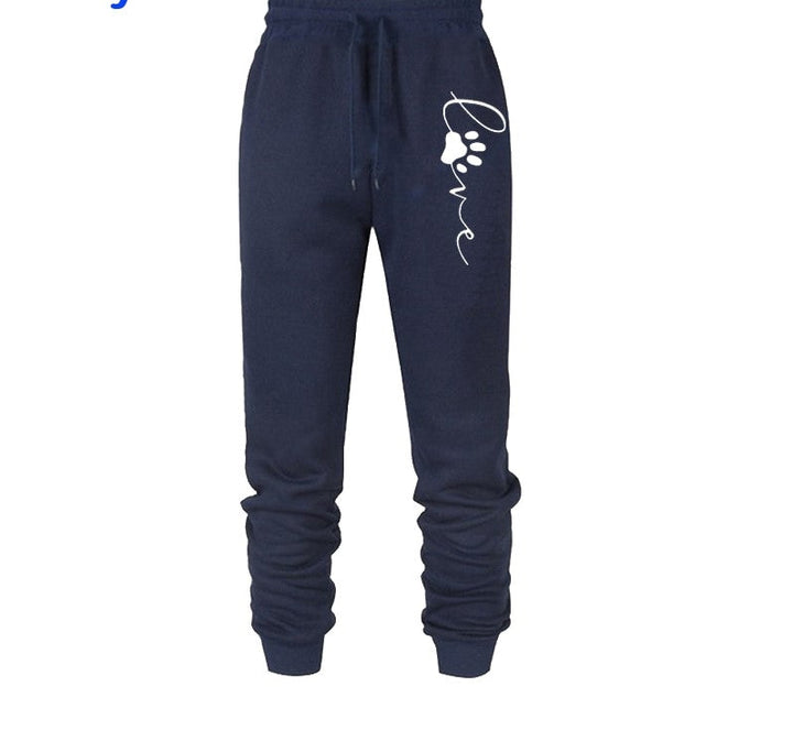 Dunkelblaue Jogginghose mit Pfotenabdruck und "love"-Schriftzug, Baumwolle, Unisex.