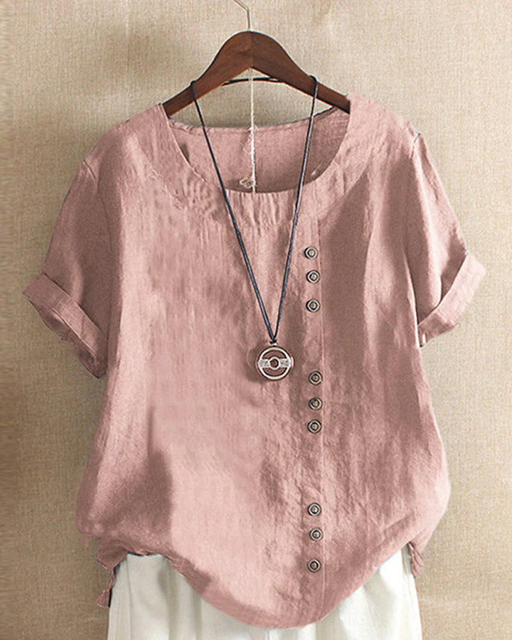 Damen Leinenbluse rosa, Knopfleiste, Kurzarm, lässig, Sommermode, hängend auf Holzkleiderbügel.