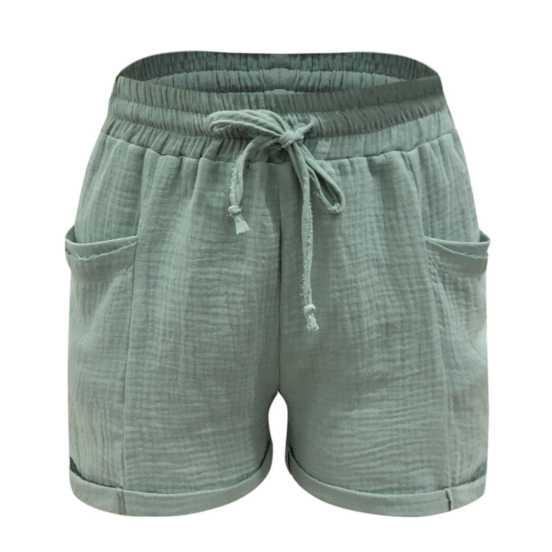 Grüne Damen-Shorts aus Baumwolle mit Kordelzug und Taschen, lässig und bequem.
