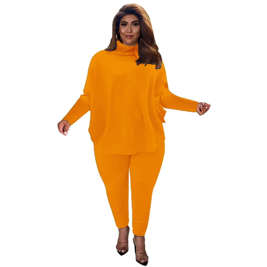 Frau in orangefarbenem Oversize-Pullover und Leggings, modisches Damen-Outfit, Herbstmode.