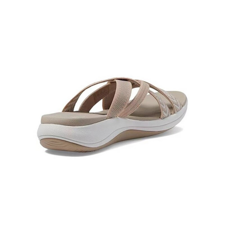 Beige Damen-Sandale mit weißen Sohlen, bequemes Design, ideal für Sommermode.