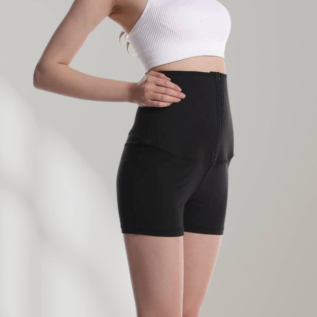 Frau in schwarzer Sauna-Sweathose mit hoher Taille, Shapewear, Fitness, Taille Trainer.